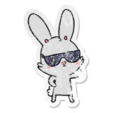 Distressed Sticker Of A Cute Cartoon Rabbit Wearing Sunglasses Royalty Free Stock Photography
