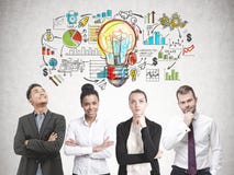Diverse business team members, business plan Stock Image Diverse business team members, business plan Stock Image