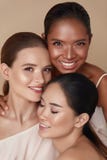 Diversity. Beauty Portrait Of Women. Multi-Ethnic Models With Natural Makeup And Perfect Skin Against Beige Background.