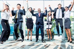 Diversity business team jumping celebrating success
