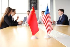 Diversity people talk the international conference partnership. Chinese flag and American flag. Stock Images Diversity people talk the international conference partnership. Chinese flag and American flag. Stock Images