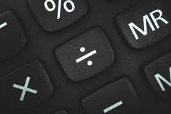 Division sign and symbol close up on calculator keyboard