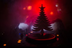Dj mixer with headphones on dark nightclub background with Christmas tree New Year Eve. Close up view of New Year elements or symb royalty free stock photography Dj mixer with headphones on dark nightclub background with Christmas tree New Year Eve. Close up view of New Year elements or symb royalty free stock photography