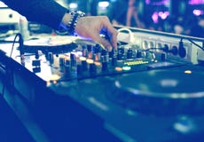 DJ Mixing Desk At Party DJ Mixing Desk At Party