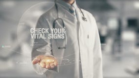 Docteur tenant le contrôle disponible votre Vital Signs photo libre de droits Docteur tenant le contrôle disponible votre Vital Signs photo libre de droits