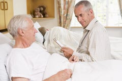 Doctor Checking Up On Senior Man In Hospital stock image Doctor Checking Up On Senior Man In Hospital stock image