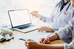 Doctor consulting with patient presenting results on blank Scree stock images Doctor consulting with patient presenting results on blank Scree stock images
