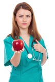 Doctor de sexo femenino que da la manzana, concepto para la forma de vida sana Imagen de archivo Doctor de sexo femenino que da la manzana, concepto para la forma de vida sana Imagen de archivo
