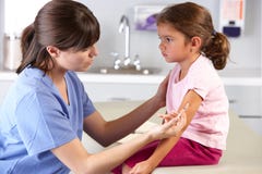 Doctor Giving Child Injection In Doctor's Office Stock Images Doctor Giving Child Injection In Doctor's Office Stock Images