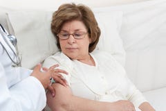 Doctor giving injection to Senior Patient Royalty Free Stock Image Doctor giving injection to Senior Patient Royalty Free Stock Image