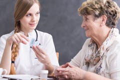 Doctor giving medicines to patient stock image Doctor giving medicines to patient stock image