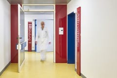 Doctor with glasses walks in the corridor of the hospital royalty free stock image Doctor with glasses walks in the corridor of the hospital royalty free stock image