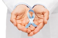 Doctor hand with prostate cancer awareness ribbon royalty free stock images Doctor hand with prostate cancer awareness ribbon royalty free stock images