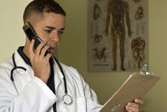 Doctor on his Cell Phone Royalty Free Stock Photo Doctor on his Cell Phone Royalty Free Stock Photo