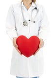 Doctor holding heart in her hands, symbol for help and insurance stock photo Doctor holding heart in her hands, symbol for help and insurance stock photo