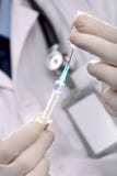 Doctor Holding Syringe Stock Photo Doctor Holding Syringe Stock Photo
