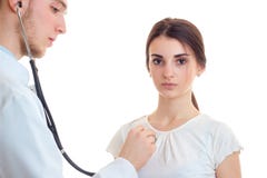 The doctor listens to the young beautiful girls heart stethoscope close-up stock photo The doctor listens to the young beautiful girls heart stethoscope close-up stock photo