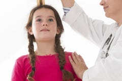 Doctor measurement the girl stature royalty free stock images Doctor measurement the girl stature royalty free stock images