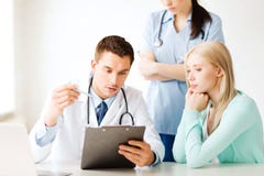 Doctor and nurse with patient in hospital Stock Images Doctor and nurse with patient in hospital Stock Images
