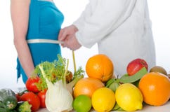 Doctor nutritionist measuring the waist of a patient stock image Doctor nutritionist measuring the waist of a patient stock image