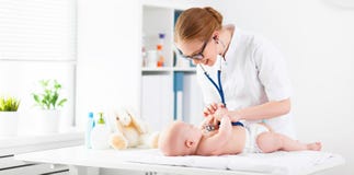 Doctor Pediatrician And Baby Patient Stock Photography