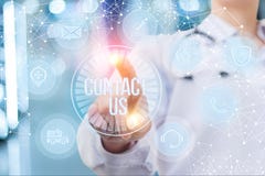 Doctor pressing the contact us button . Royalty Free Stock Photography Doctor pressing the contact us button . Royalty Free Stock Photography
