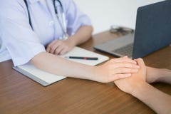 The doctor`s hand makes the male patient confident royalty free stock photo The doctor`s hand makes the male patient confident royalty free stock photo