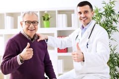 Doctor specialist and patient shows finger up Royalty Free Stock Photography Doctor specialist and patient shows finger up Royalty Free Stock Photography