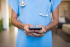 Doctor using mobile phone in hospital stock images Doctor using mobile phone in hospital stock images
