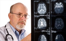 Doctor Viewing MRI Films stock images Doctor Viewing MRI Films stock images