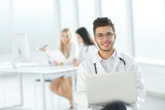 Doctor works on a laptop in the hospital room stock images Doctor works on a laptop in the hospital room stock images