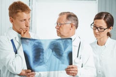 doctors-examine-x-ray-image-hospital-professor-older-men-doctor-young-lungs-41818302.jpg