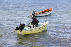 Documentary editorial image. Fisherman on small wood boat Royalty Free Stock Photos Documentary editorial image. Fisherman on small wood boat Royalty Free Stock Photos