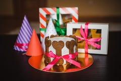 Dog cake and cookie in boxes with birthday hat royalty free stock images Dog cake and cookie in boxes with birthday hat royalty free stock images