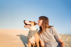 Dog and human make fun, posing as best friends. Funny female per stock photos Dog and human make fun, posing as best friends. Funny female per stock photos