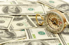 Dollars And Compass. Royalty Free Stock Images