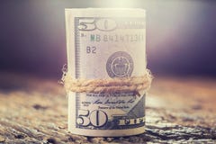 Dollars rolled banknotes closeup. Cash Money American Dollars.Close-up view of stack of US dollars stock images Dollars rolled banknotes closeup. Cash Money American Dollars.Close-up view of stack of US dollars stock images