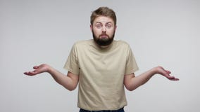 Don`t know, sorry! Embarrassed bearded guy spreading hands shrugging shoulders, looking with confused uncertain expression, having