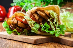 Doner kebab - fried chicken meat with vegetables Stock Photography Doner kebab - fried chicken meat with vegetables Stock Photography