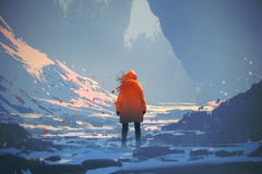 Donna con il rivestimento caldo arancio che sta nel paesaggio di inverno Fotografia Stock Donna con il rivestimento caldo arancio che sta nel paesaggio di inverno Fotografia Stock