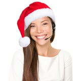Donna della cuffia avricolare di natale immagini stock libere da diritti Donna della cuffia avricolare di natale immagini stock libere da diritti