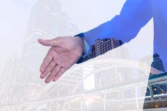 Double exposure of Businessman extending hand to shake with city background royalty free stock images Double exposure of Businessman extending hand to shake with city background royalty free stock images