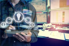 Double exposure of Engineer or Technician man with business industrial tool icons while using tablet with monitor of computers stock images Double exposure of Engineer or Technician man with business industrial tool icons while using tablet with monitor of computers stock images