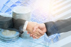 Double exposure of two businesswoman handshake and coins on bank royalty free stock photography Double exposure of two businesswoman handshake and coins on bank royalty free stock photography