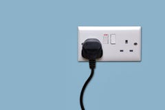 Double power socket and single plug switched on royalty free stock photography Double power socket and single plug switched on royalty free stock photography