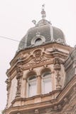 The down view of the old gothic house under the white sky. The down view of the old gothic house under the white sky Royalty Free Stock Photos The down view of the old gothic house under the white sky. The down view of the old gothic house under the white sky Royalty Free Stock Photos