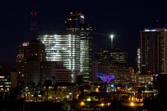 Downtown Phoenix Office Buildings at Night. Busy downtown Phoenix, Arizona, on a Saturday night after dark with lighted signs, streets, modern business buildings Downtown Phoenix Office Buildings at Night. Busy downtown Phoenix, Arizona, on a Saturday night after dark with lighted signs, streets, modern business buildings