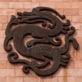 Dragon. Pattern of the decoration on the yellow wall stock image Dragon. Pattern of the decoration on the yellow wall stock image