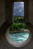 Dramatic Keyhole view of Rhein Rhine water fall in switzerland, background has green forest and dramatic cloudy sky