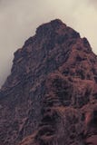 Dramatic mountains sinking in dusk clouds royalty free stock photography Dramatic mountains sinking in dusk clouds royalty free stock photography